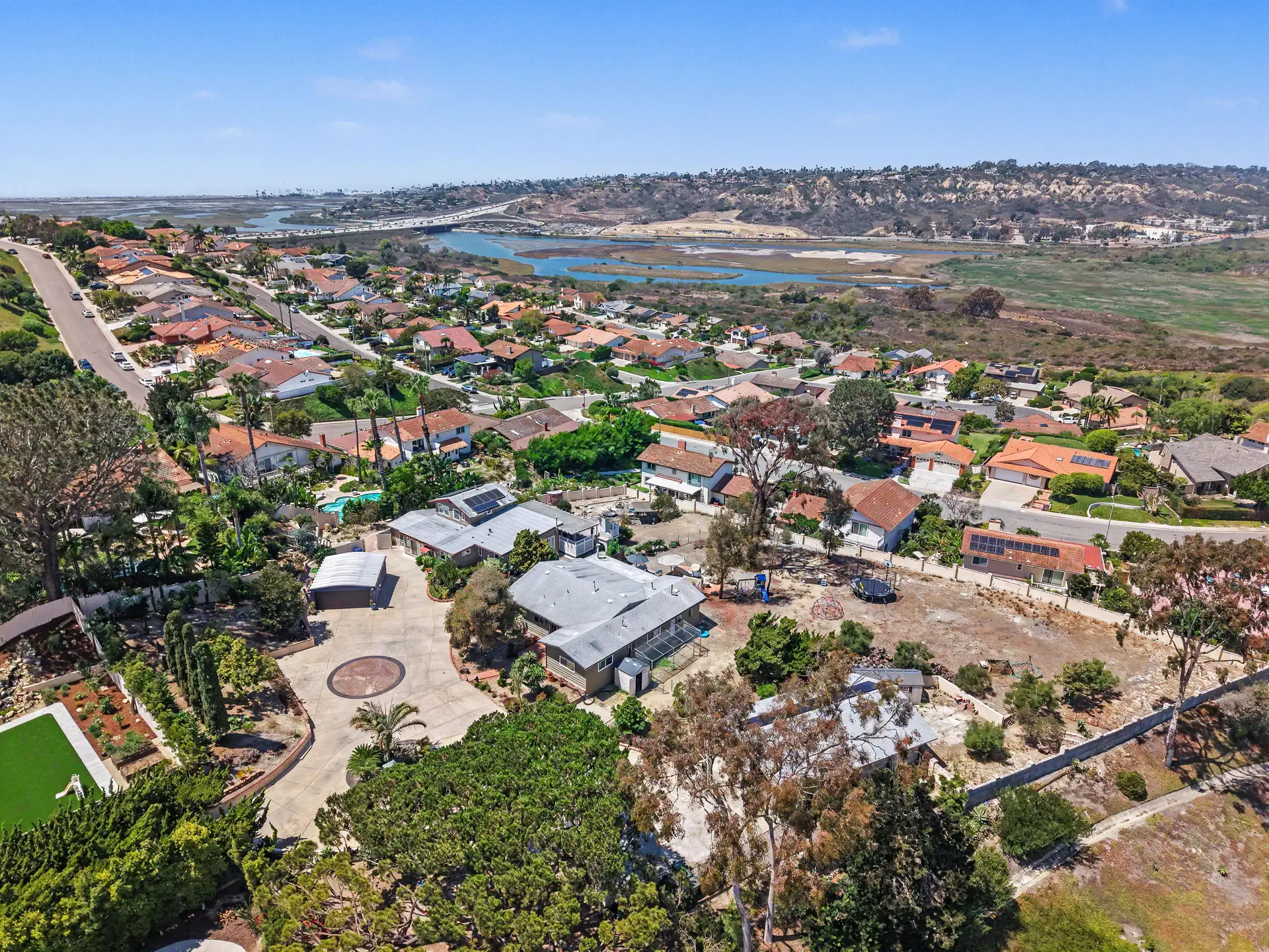 Aerial view of San Elijo Lagoon opening westward to the sea, north of the parcel.