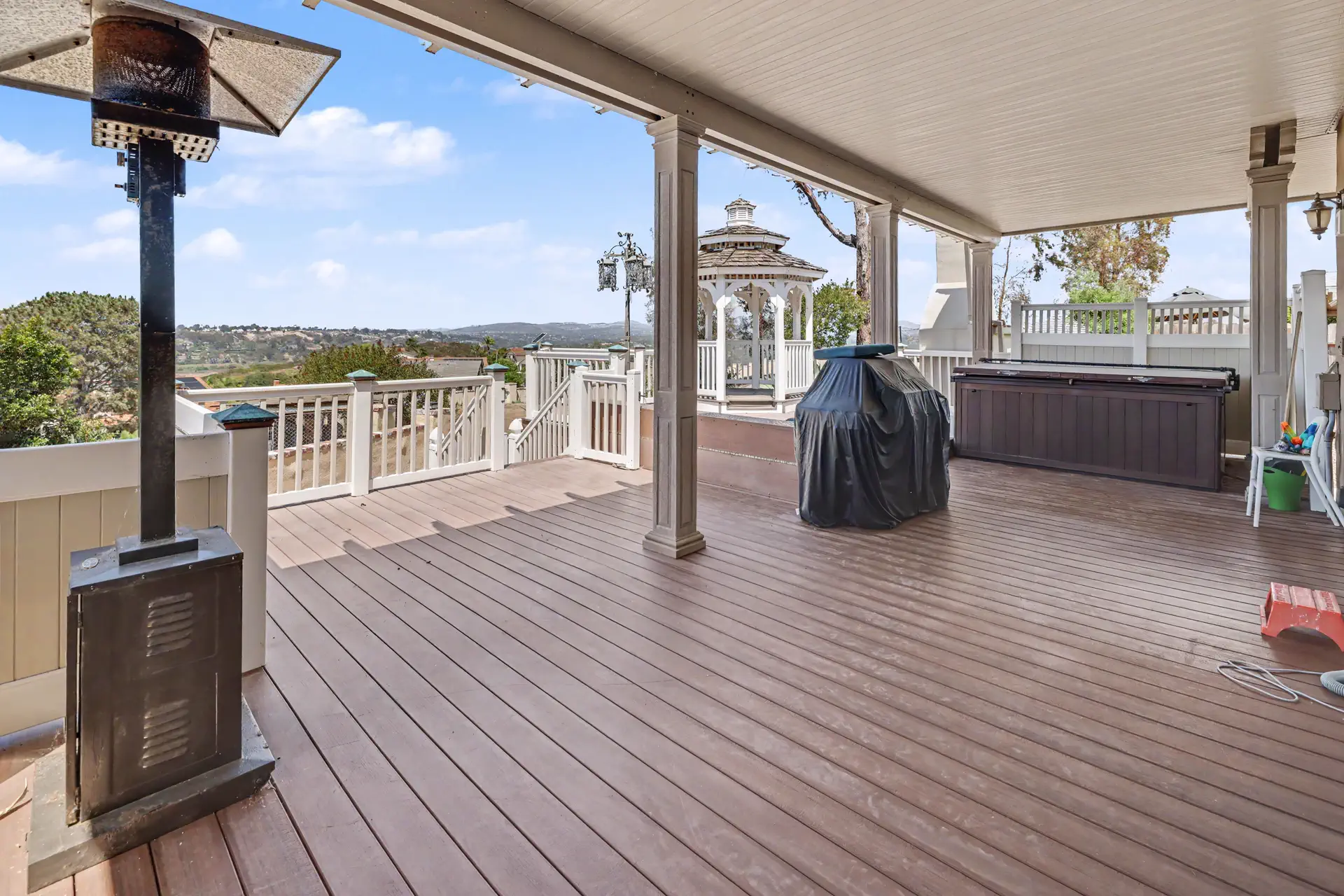 The covered deck of the main residence looking out over the hills.